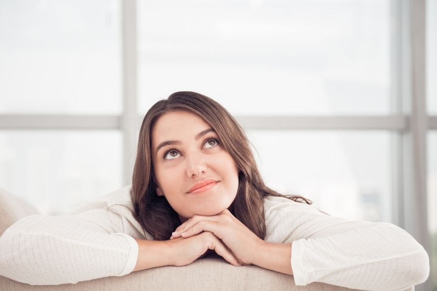A girl trying to determine her Aspirational goals for herself and trying to stop procrastinating